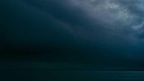 Clip frame 1: dark storm clouds over the sea