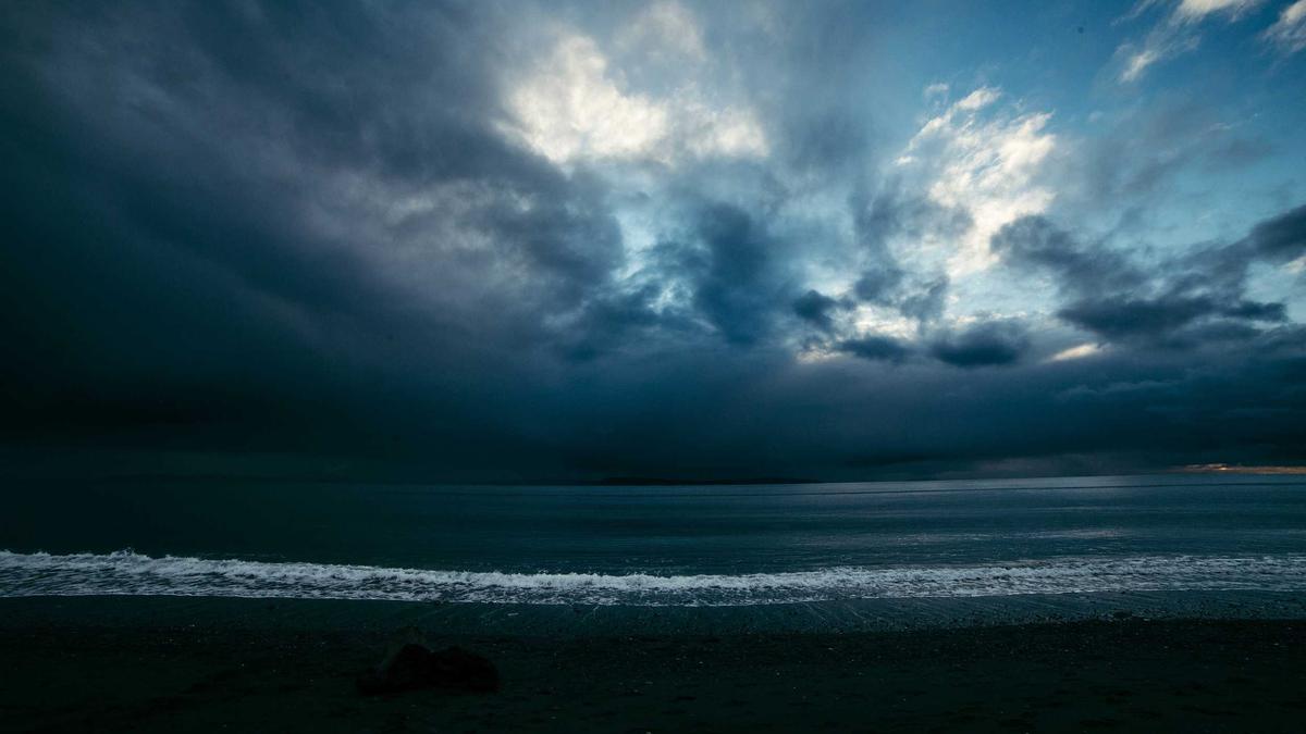 Preview frame of a generated clip: storm light breaking over a dark sea